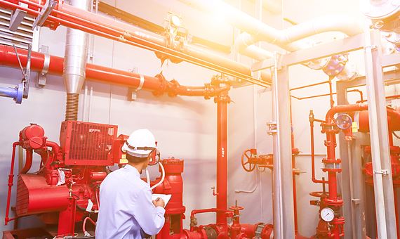 fire protection engineer analyzing machinery