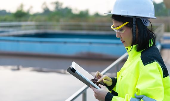 enviromental engineer inspecting a river