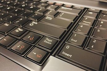 Close-up of a black computer keyboard, symbolizing data access and digital forensics processes.