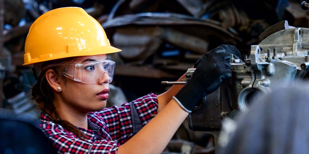 Engineer Woman Working With Machine In Factory